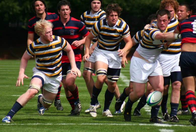 the rugby players are trying to get the ball