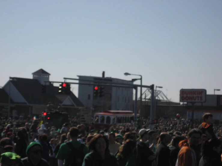 a crowd of people gathered in front of the buildings