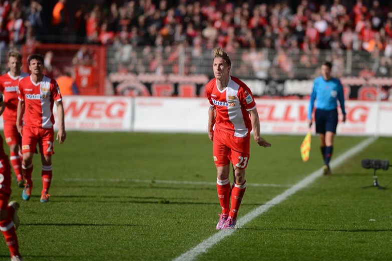 a soccer player in red during a game