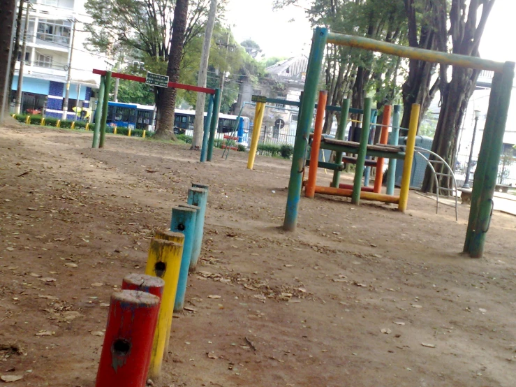a playground at a park with toys and benches