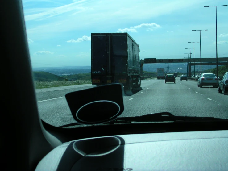 view from inside the car on a highway with traffic