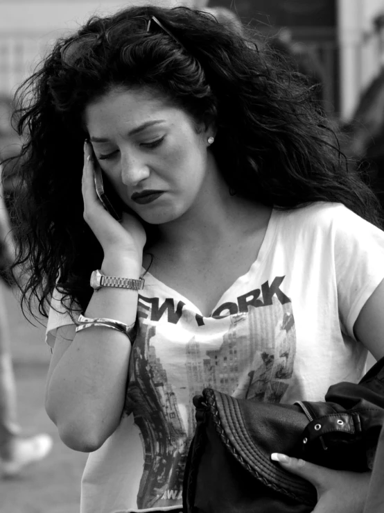 a woman with long hair talking on her cell phone