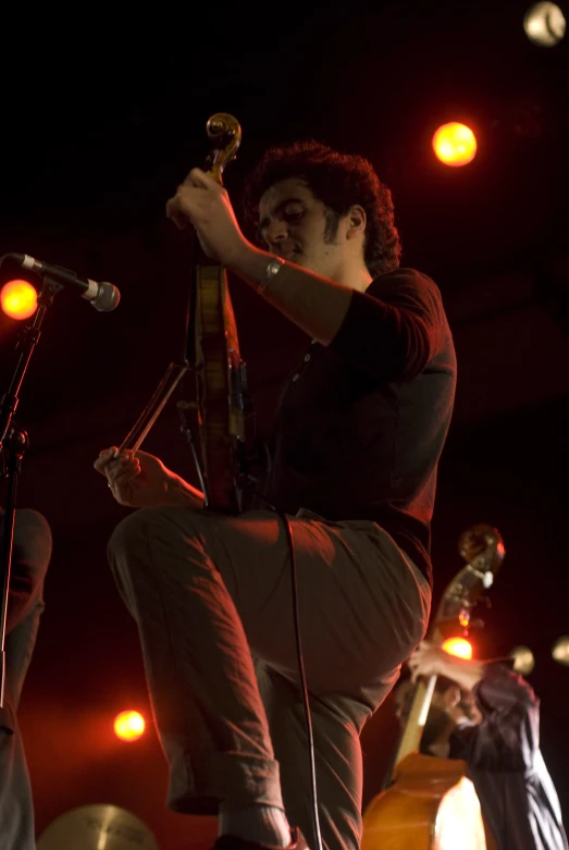 a man on stage performing for the audience