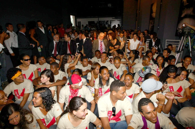 a large group of people are gathering in a building