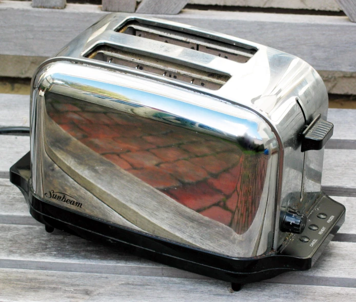 there is a silver toaster with soing in it