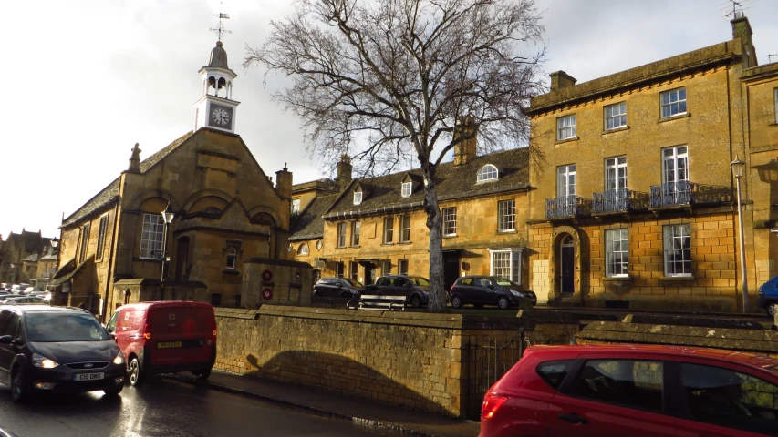 a couple of cars that are by some buildings