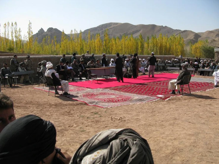 people in nizd sit and pray