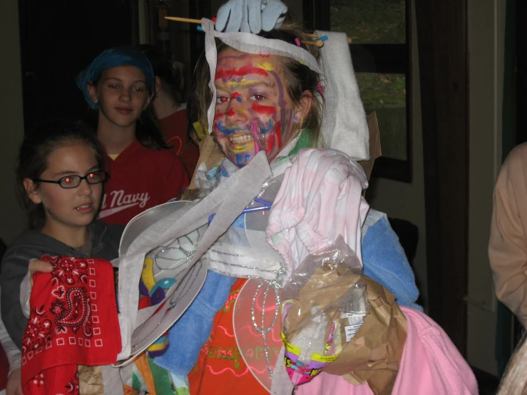 two children with face painted in costume