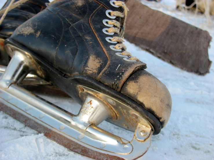 a worn out pair of ice skates in the snow
