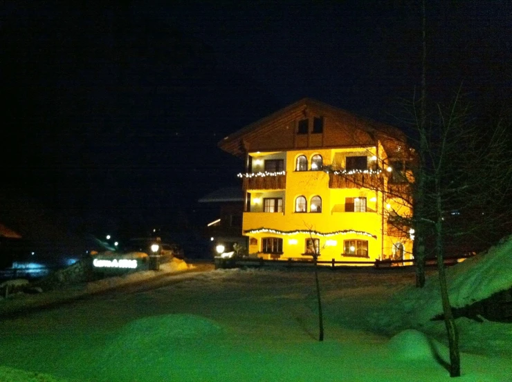 a large house that is decorated in christmas lights