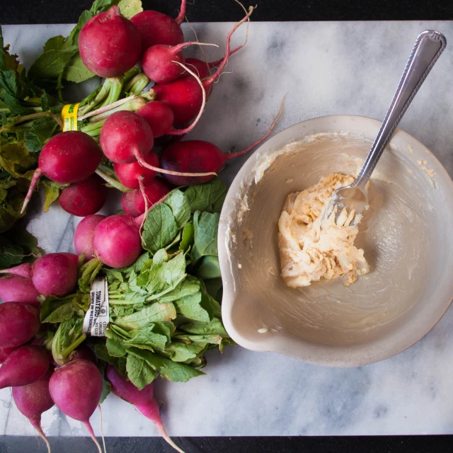 a bowl of radishes and a bowl of ice cream