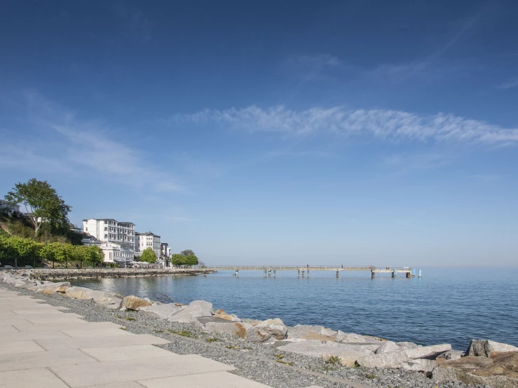 there is water and buildings on the shoreline