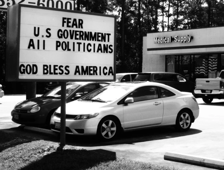 a political sign reading, fear u s government all politicians, god bless america