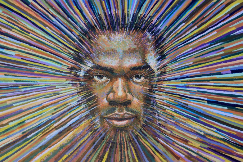 a close up of a man's face with a lot of lines and color