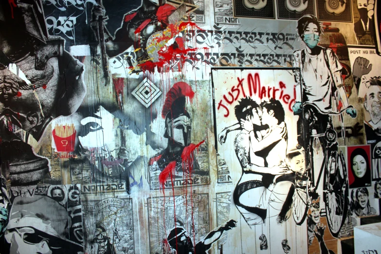 a wall covered in graffiti next to a black and white picture