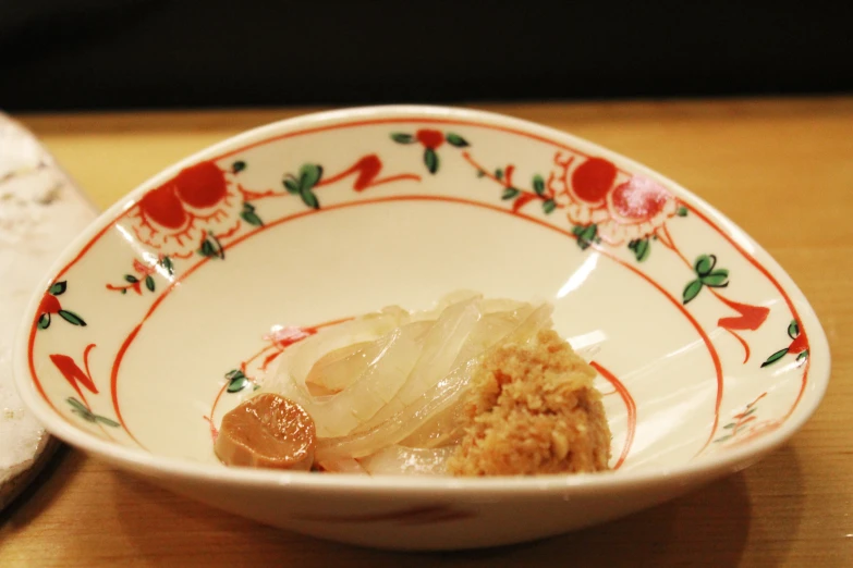 the asian dish is placed in a bowl with spoon