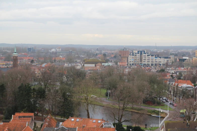 an overview of a city, including river, with houses and buildings in the distance