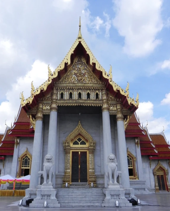 an ornately decorated building with gold columns