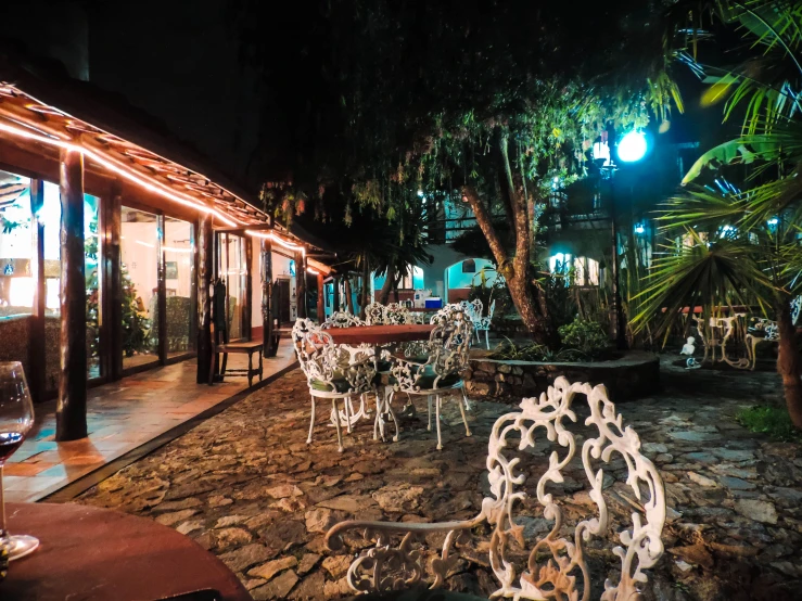 outdoor patio and seating area with bright lights