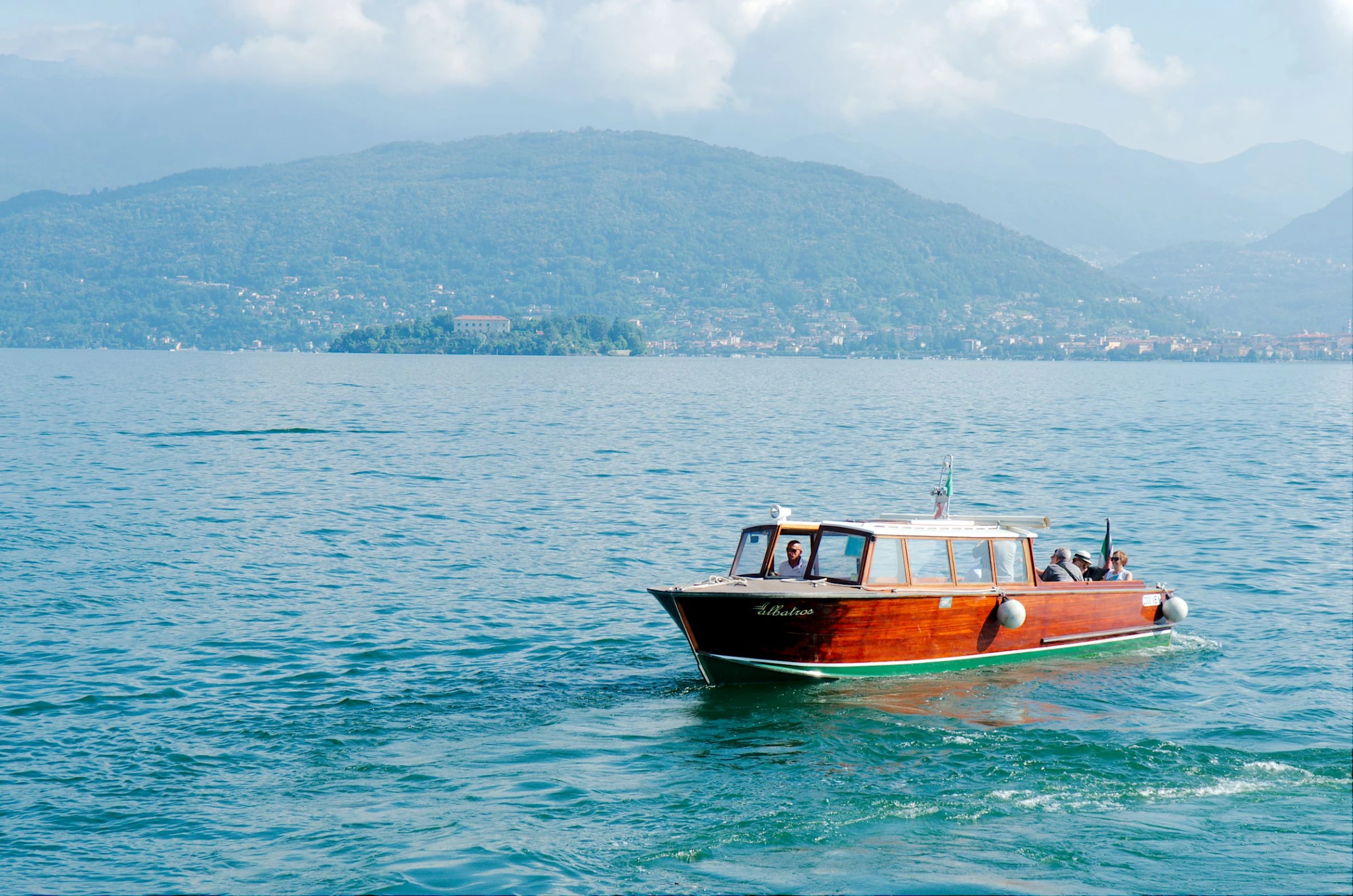 a brown boat in the middle of a large body of water