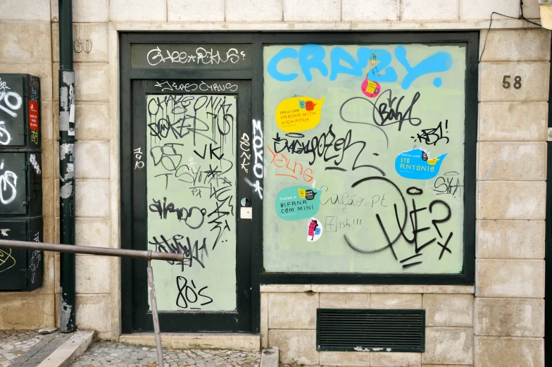 an image of graffiti written on glass doors