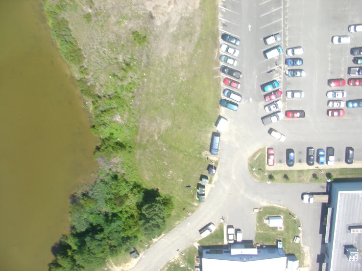 a parking lot next to a body of water