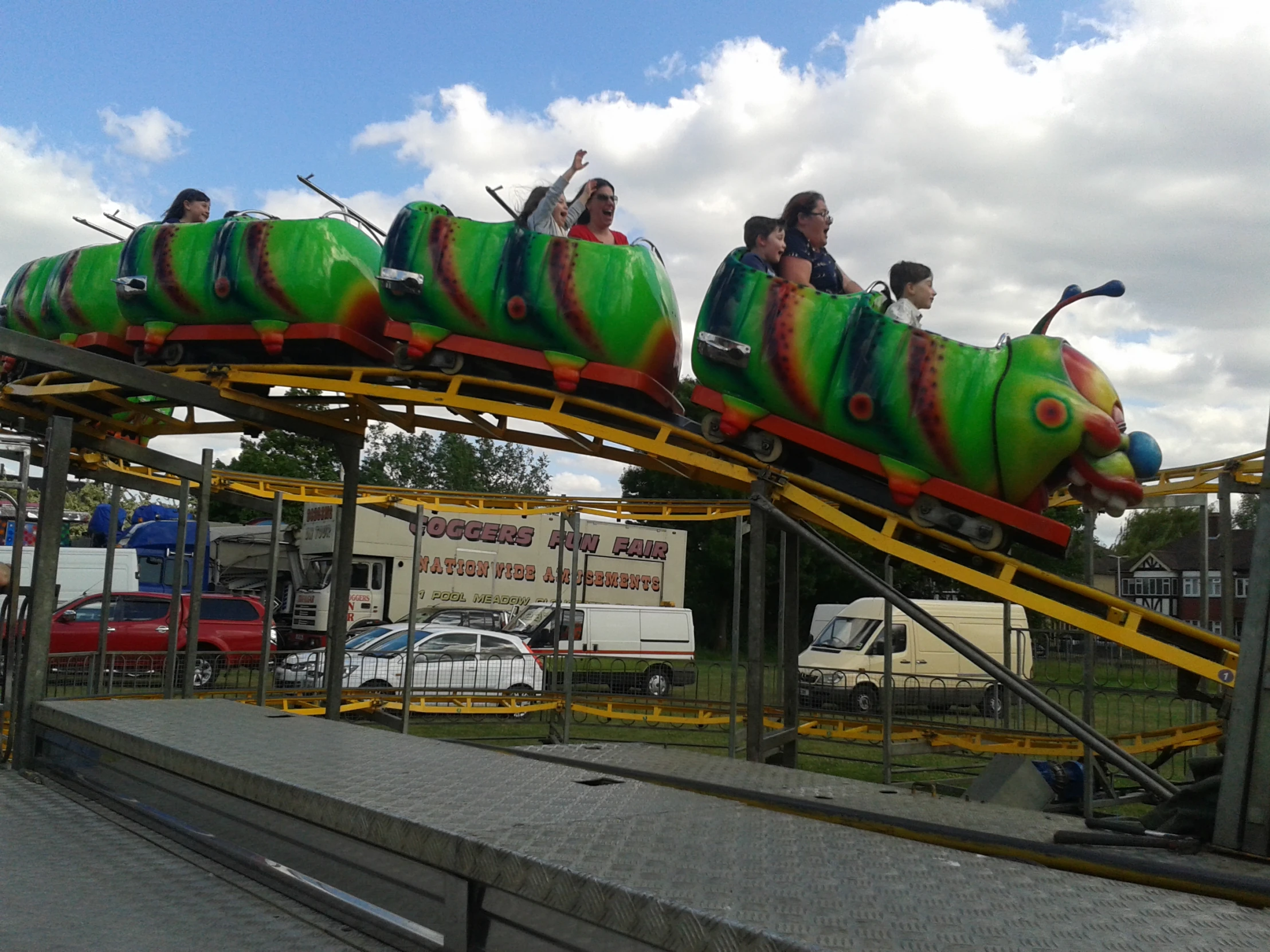 s riding a ride on a roller coaster