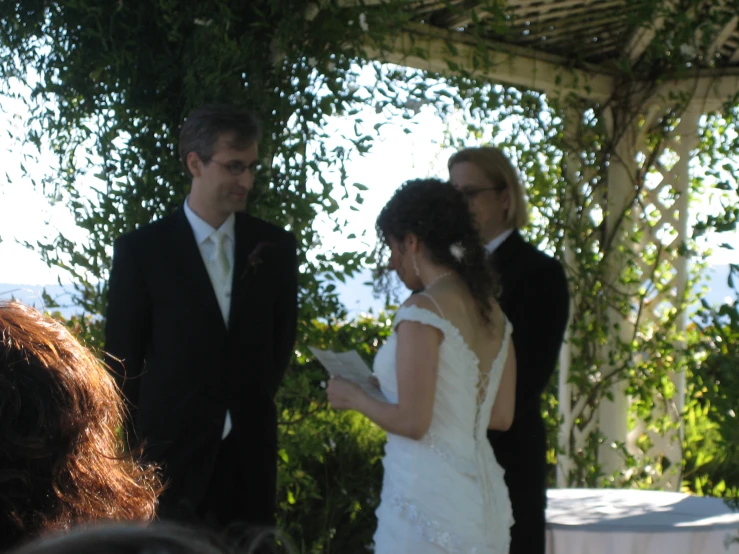 a couple standing under a covered area together