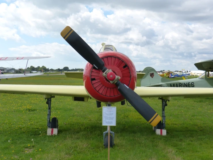 an airplane on display with a jet engine attached to the wing
