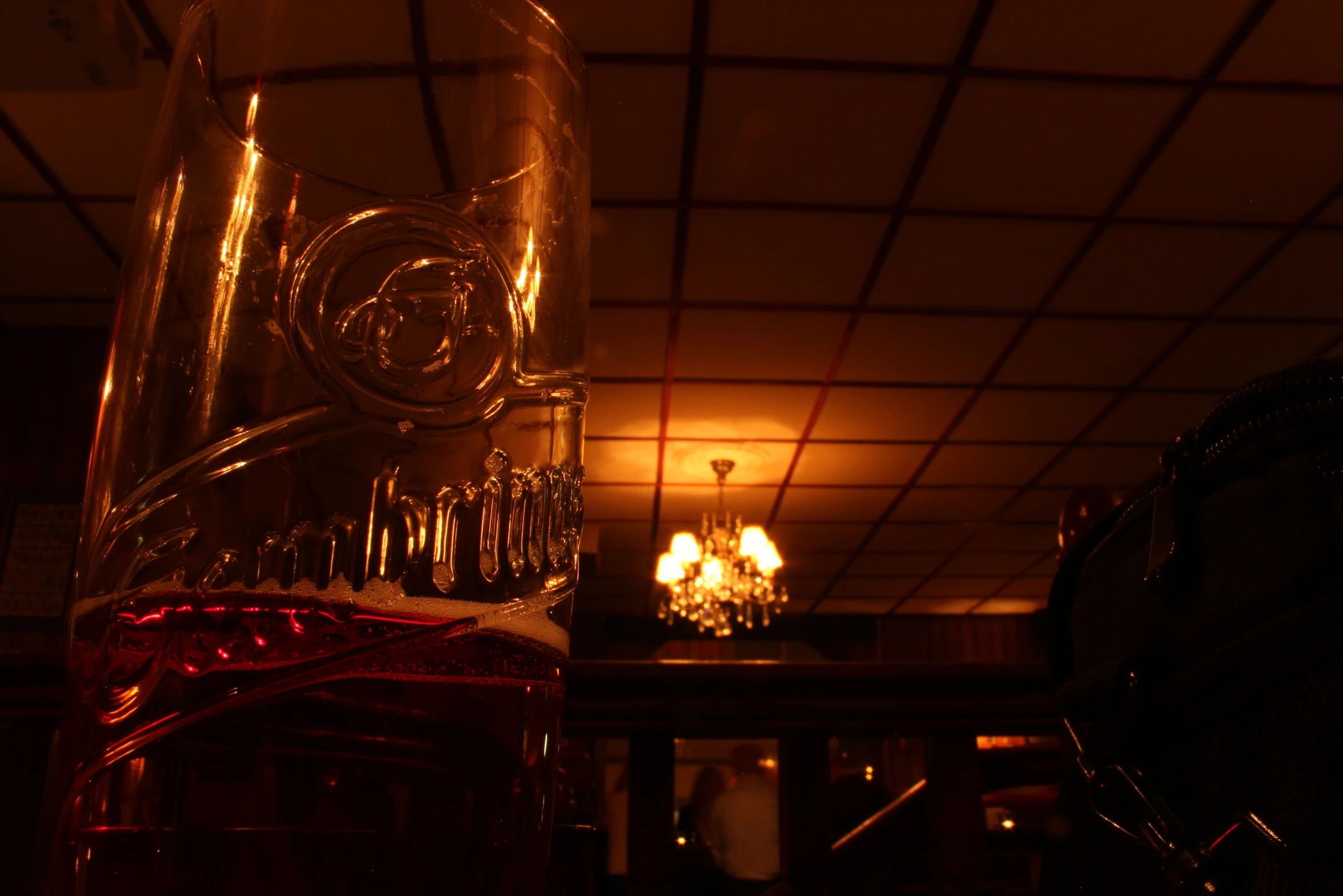 a glass vase filled with liquid on top of a table