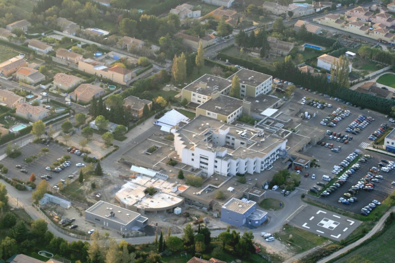 a parking lot and a white building in the foreground