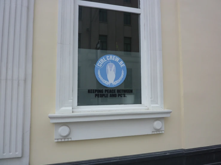 there is a sign in the window of a building