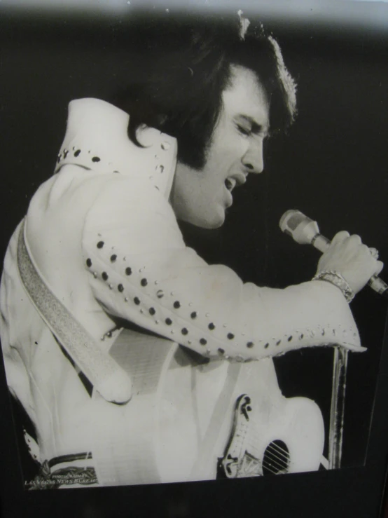 a elvis style outfit is shown in black and white