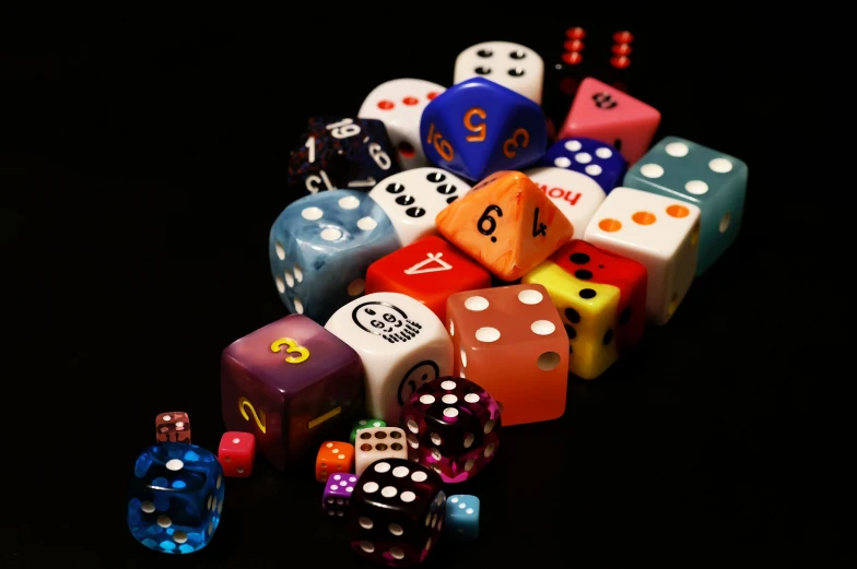 several dice are stacked in one pile on a table