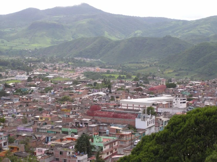 an overview of a town surrounded by hills