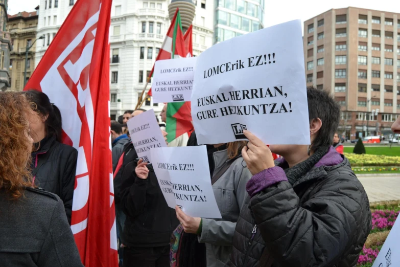 a large group of people holding up signs