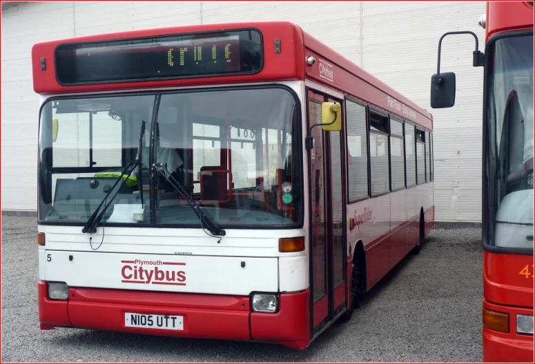 the bus has red doors and windows on it