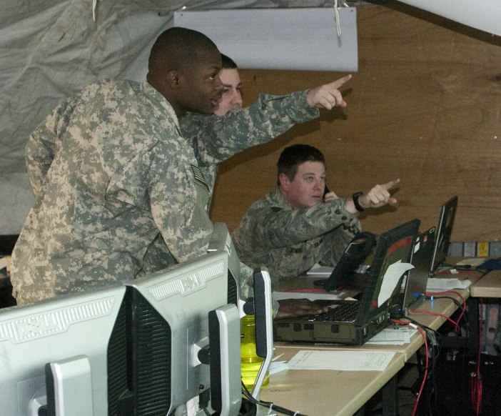 two men in uniform giving instructions to each other