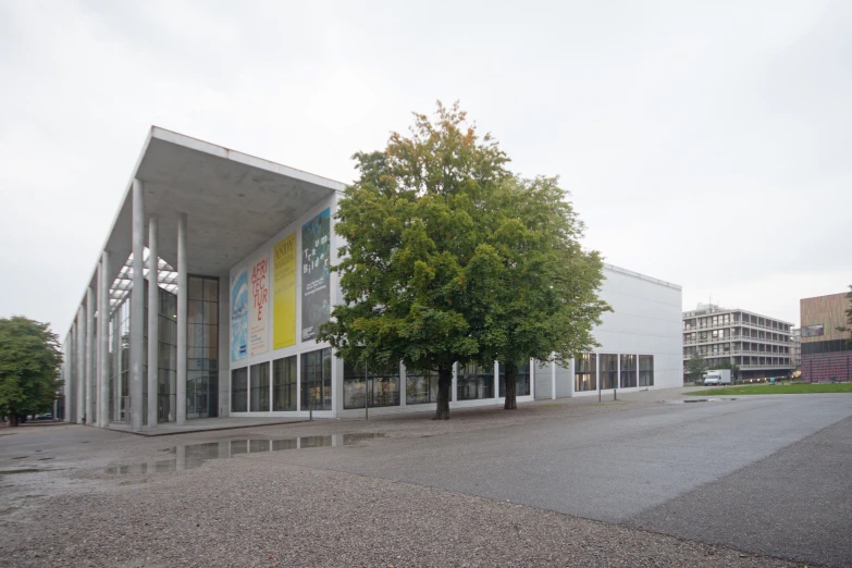 a white building with windows on the sides