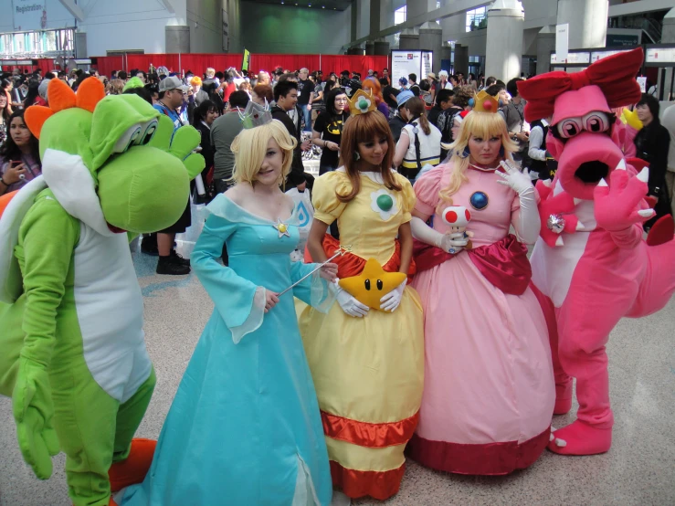 a group of people in costume at an convention