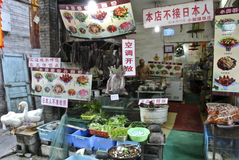 an outdoor food market selling various types of foods