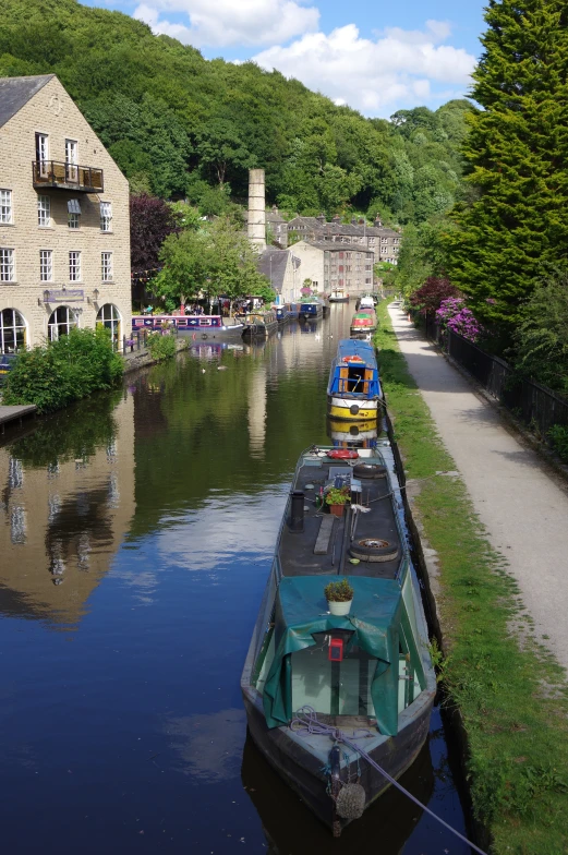 boats parked on the side of a canal