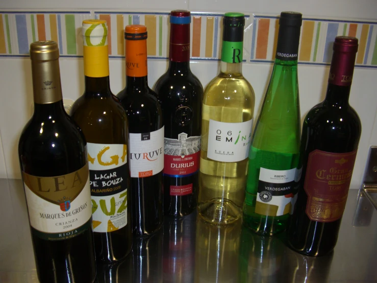 several bottles of wine are lined up in a circle