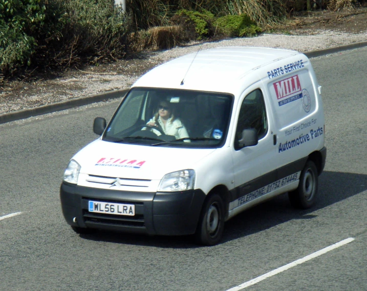 a white van parked on the side of the street