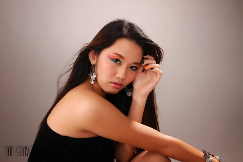 an attractive young woman with long brown hair posing