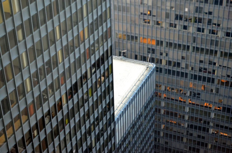 an aerial view of tall buildings with lots of windows