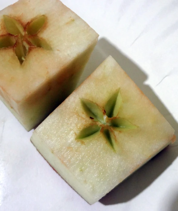 two slices of soap with leaves on them