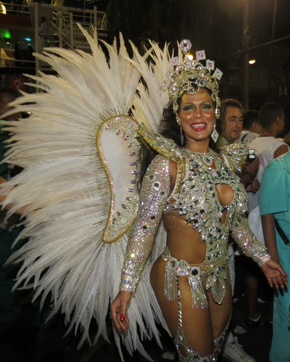 a woman wearing a feathery outfit and headdress