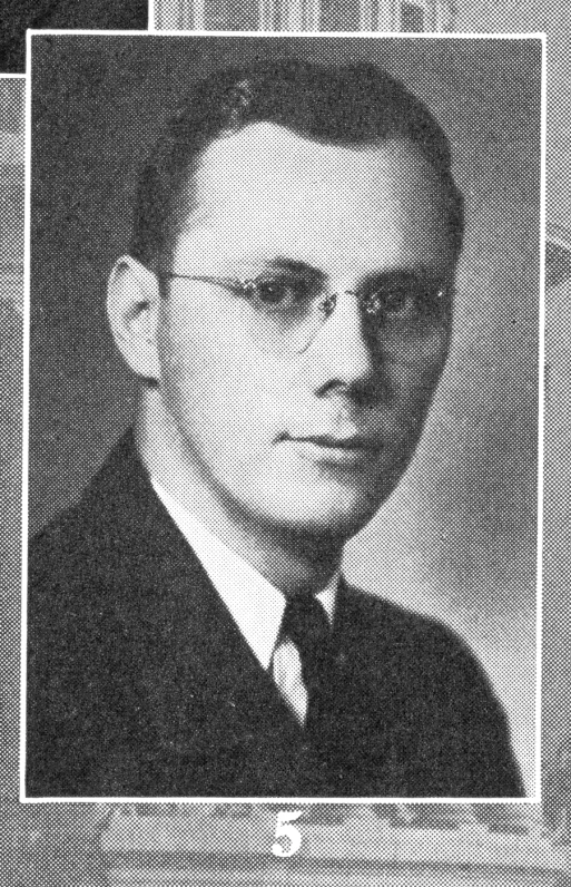 a man with glasses and a tie on