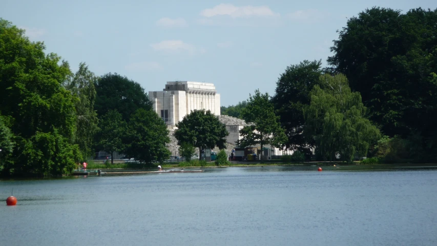 a body of water next to tall buildings